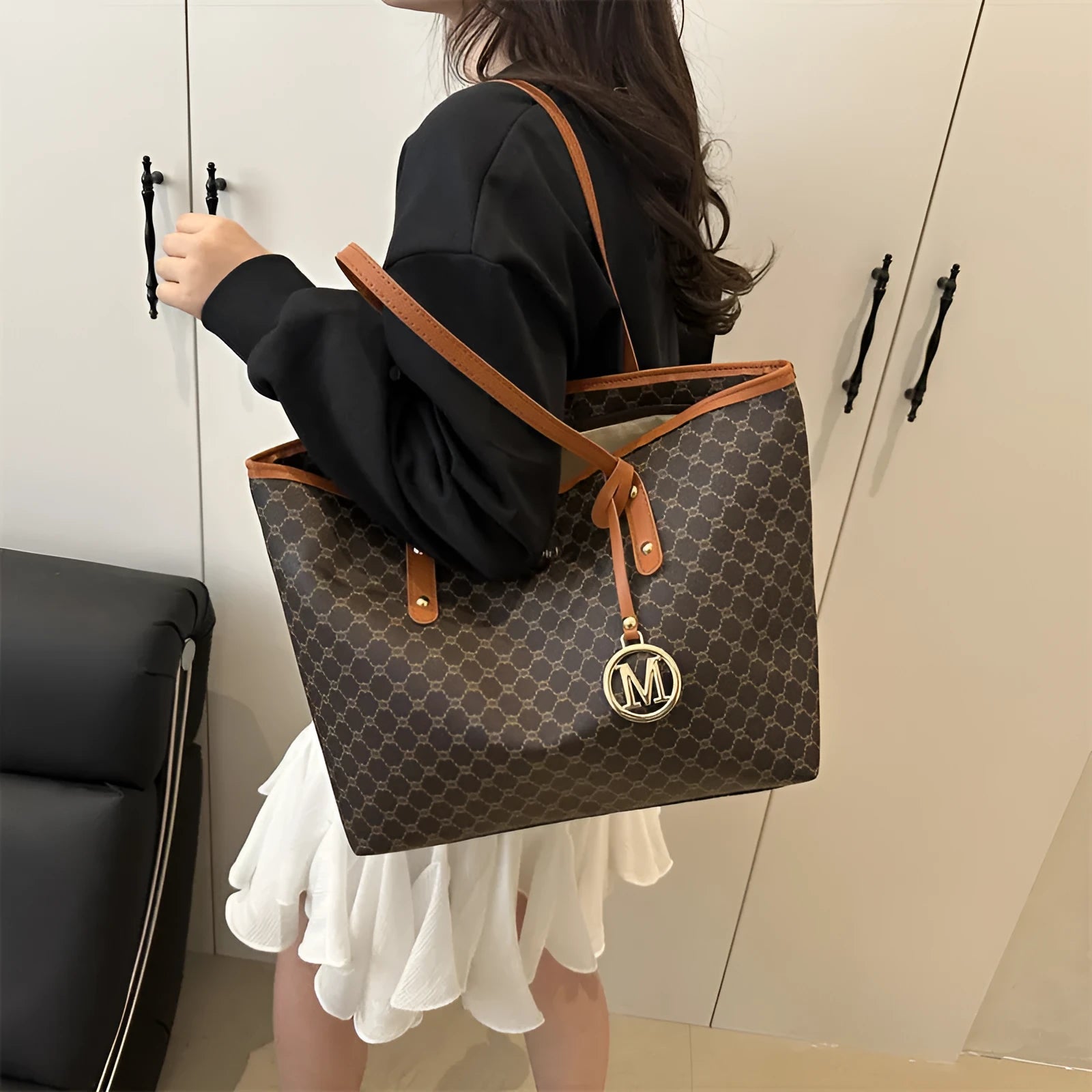 Black PU shoulder bag with sewing thread detail, showing interior polyester lining.