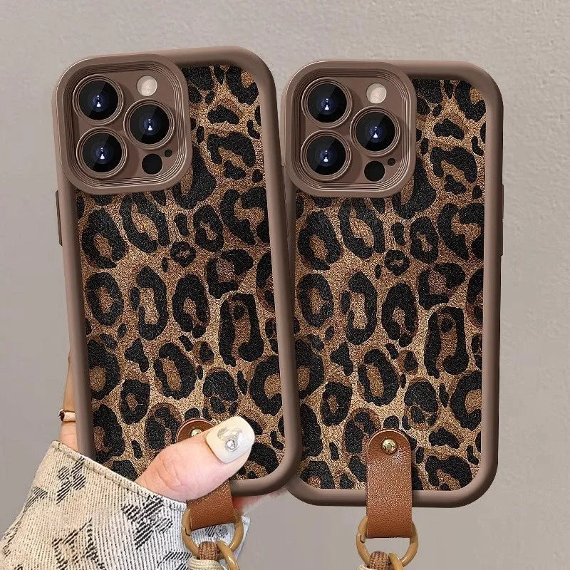 Brown leopard print silicone lanyard phone case for iPhone on a table