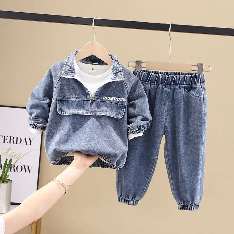 Boys' black denim two-piece suit with long sleeves, shown on a hanger.
