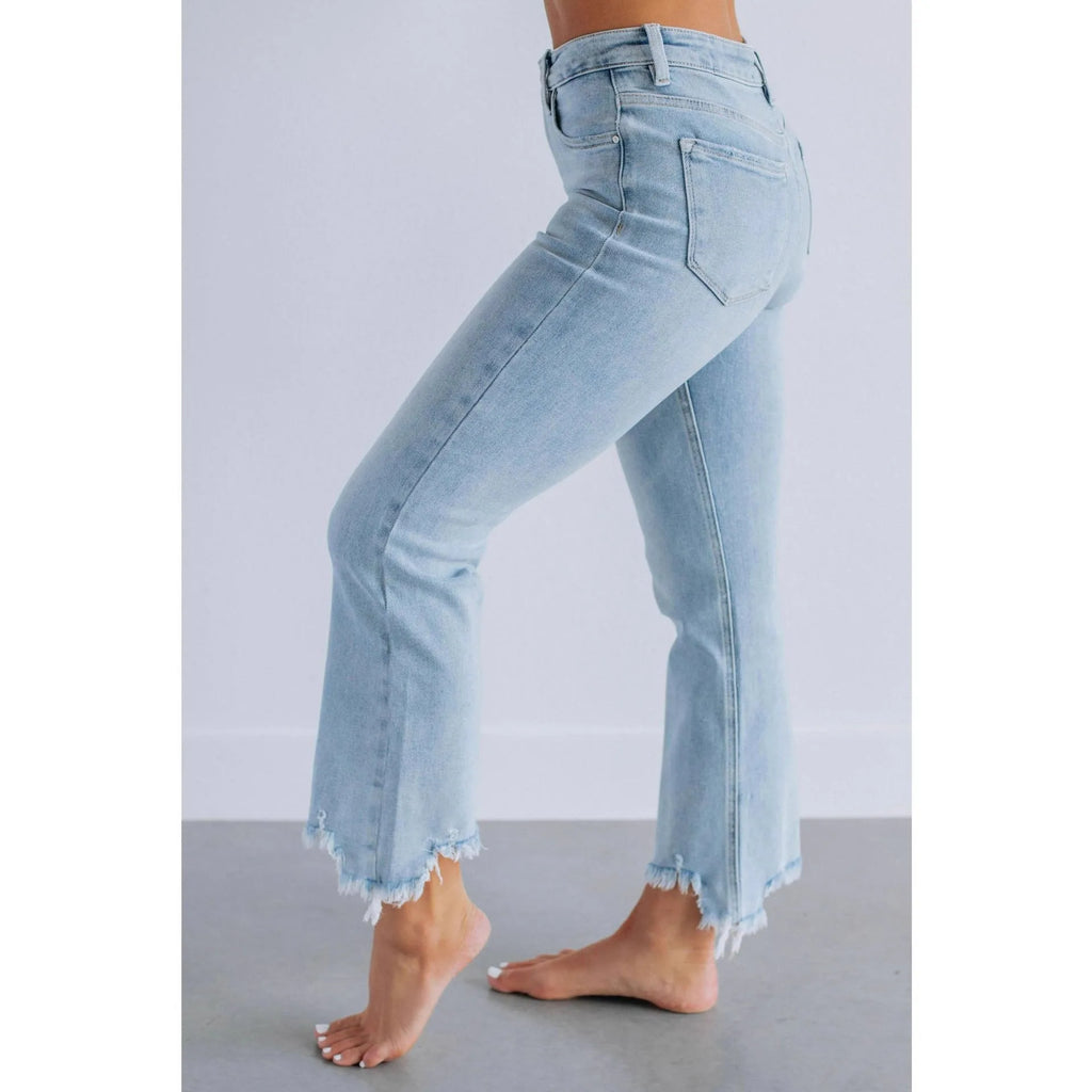 Women's solid colour denim trousers with hand-distressed detailing in dark blue wash