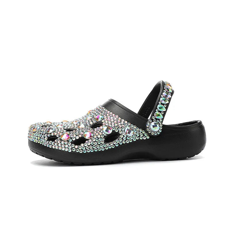Black women's platform sandals with rhinestone straps and a textured EVA sole.