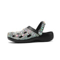Black women's platform sandals with rhinestone straps and a textured EVA sole.