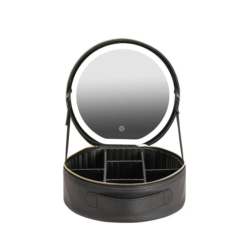 Round black PU leather makeup bag with open lid showing internal LED mirror and cosmetic partitions.