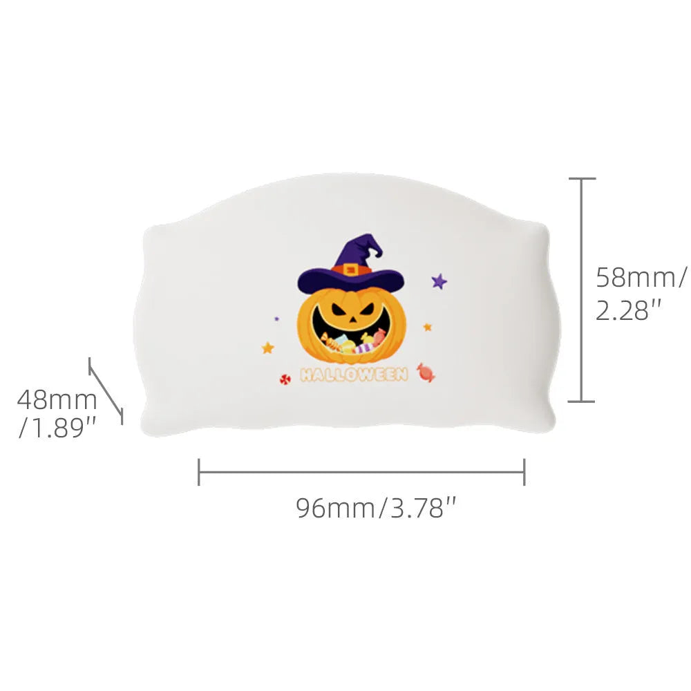 Cartoon Halloween ghost doll table lamp with warm LED light on a bedside table.