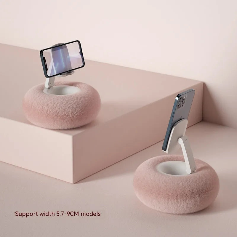 Adjustable rotating bracket holding a tablet on a desk, showing vertical lift and clamp mechanism.