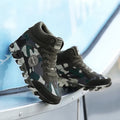 Women's green camouflage canvas sneakers with rubber soles