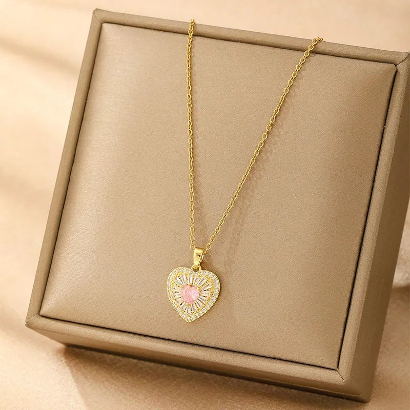 Women's copper necklace showing four pendant options: heart shape, round diamond, butterfly, and cross designs