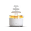 White cloud rain humidifier and essential oil diffuser with LED mood lighting on table
