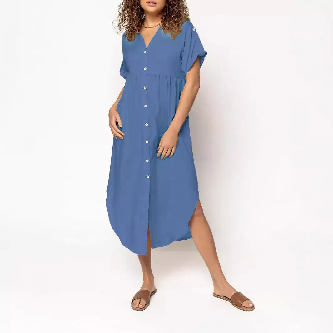 Loose mid-length casual dress in solid colour with button front detail, shown on a hanger.