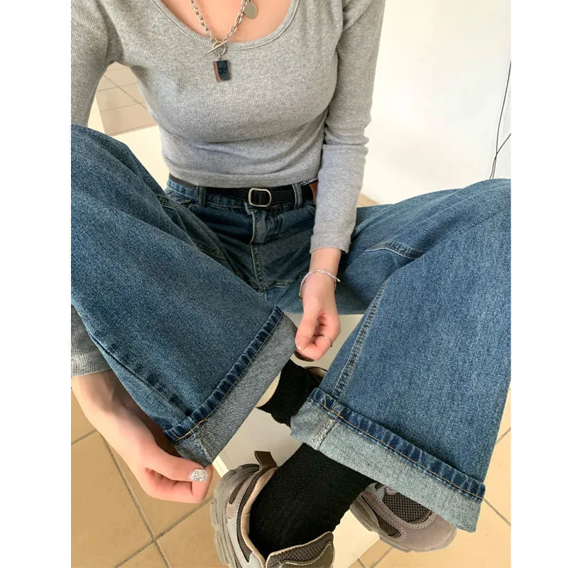 Women's high-waisted retro blue straight-leg jeans on a neutral background
