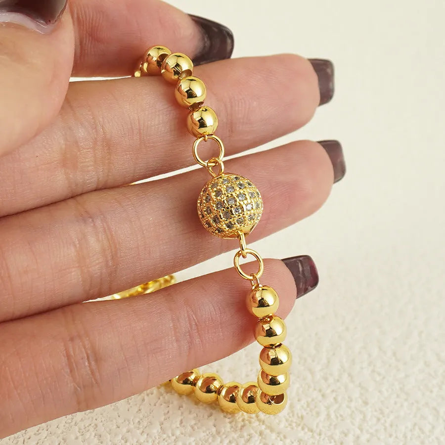 Arabic style women's copper bracelet with heart-shaped pendant featuring single zircon stone