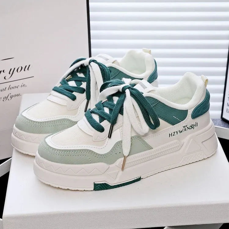 Beige children's board shoes with thick rubber sole, cross shoulder straps, and front lace-up closure on a white background.