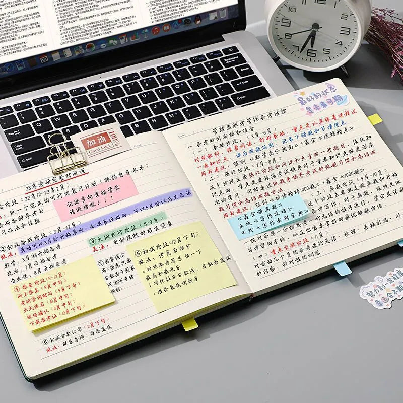 Square faux leather notebook in peach pink, avocado green, or grey green with blank, lined, or grid pages.