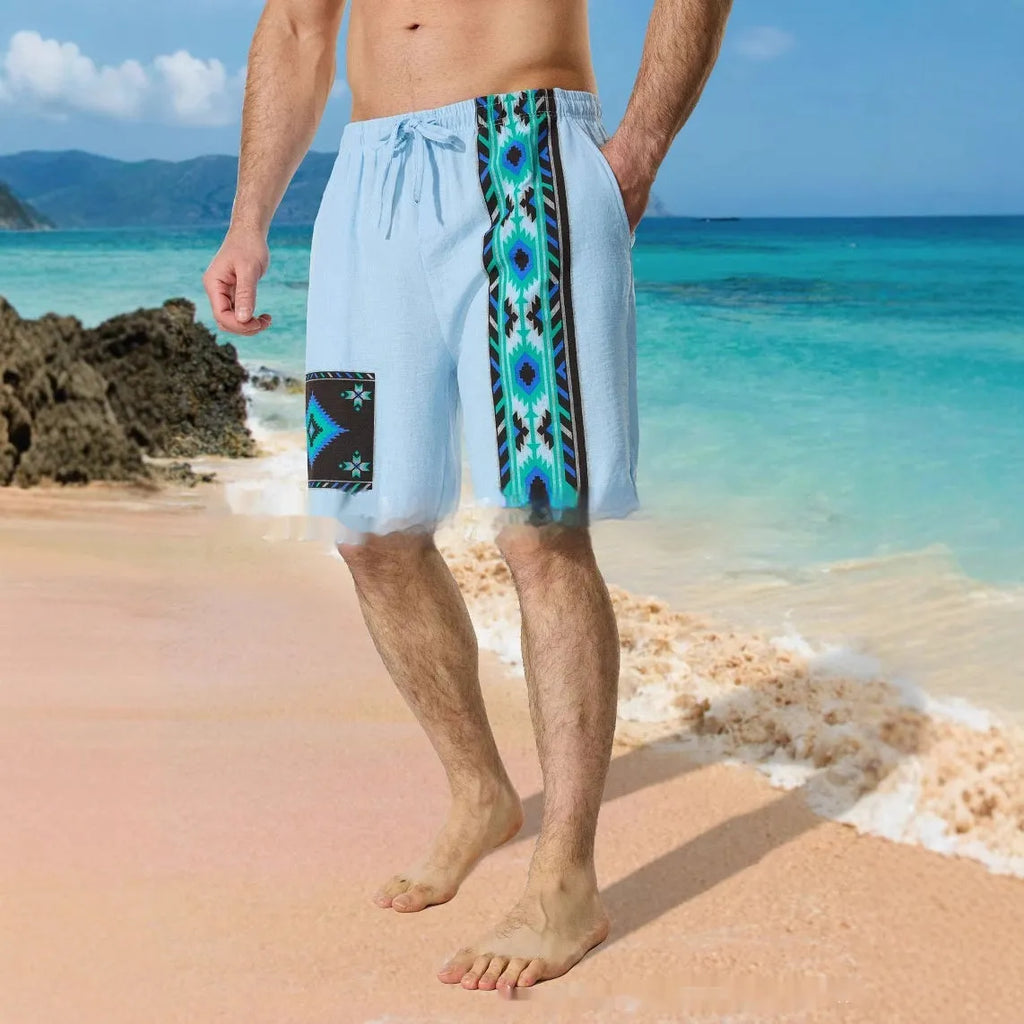 Man wearing blue colour block digital print casual shorts with a lace-up drawstring waist.