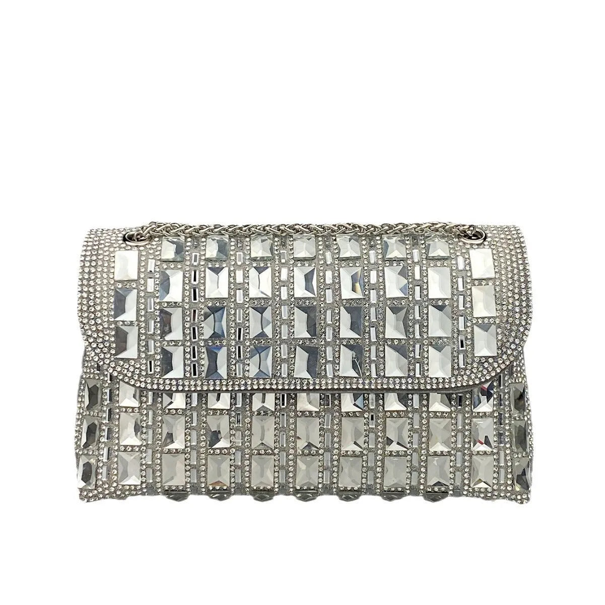 Silver rhinestone chain clutch bag with square shape and internal phone pocket on a table.