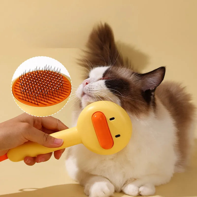 Small yellow and white pet grooming comb with needle teeth for cat and dog hair removal.