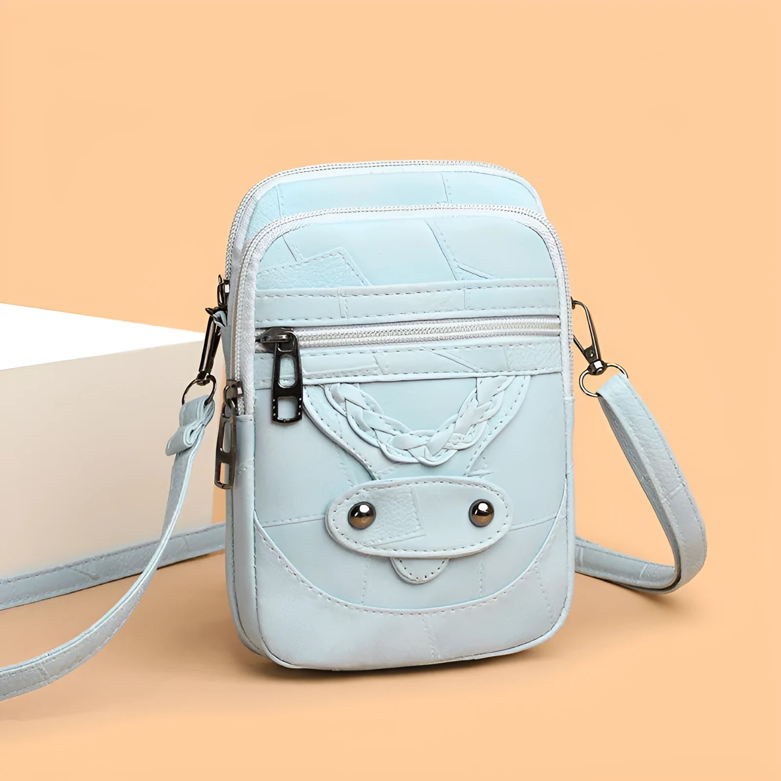 Soft brown PU leather square vertical mobile phone bag with woven detailing and rivets.