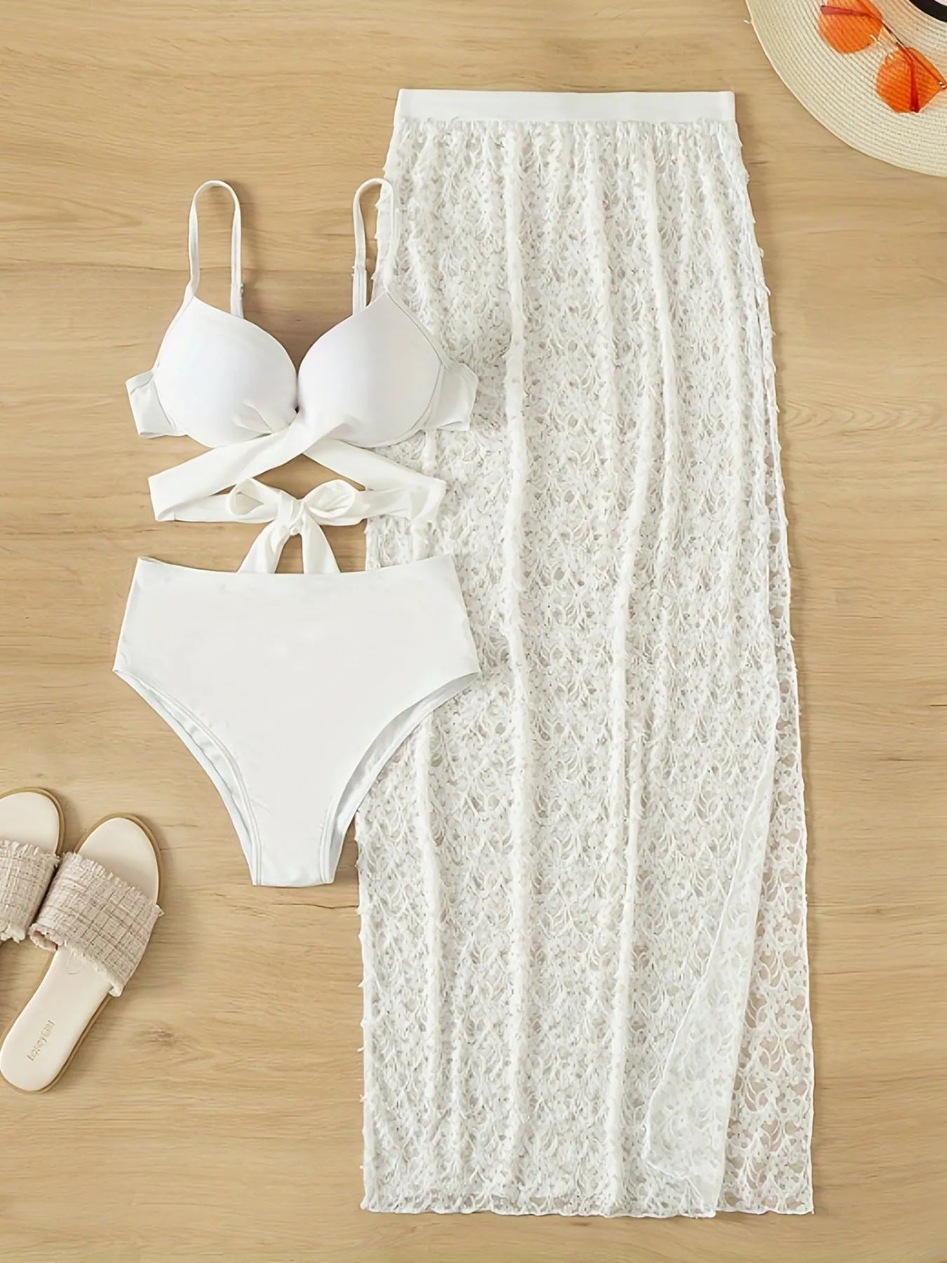White three-piece swimsuit set with long gathered skirt, sleeveless top, and matching pants for swimming