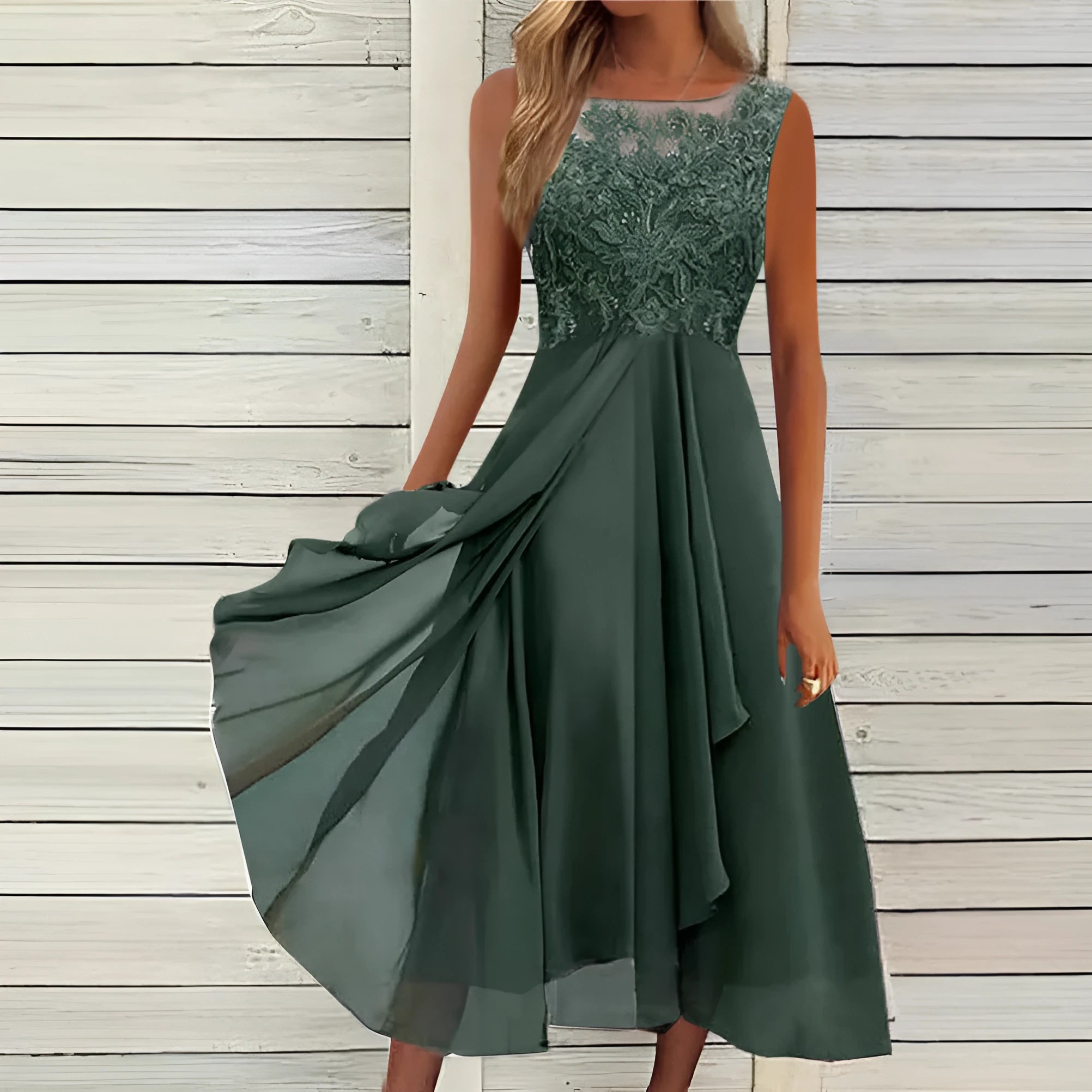 Women's sleeveless green chiffon dress with lace embroidery and a mid-length flowy skirt.