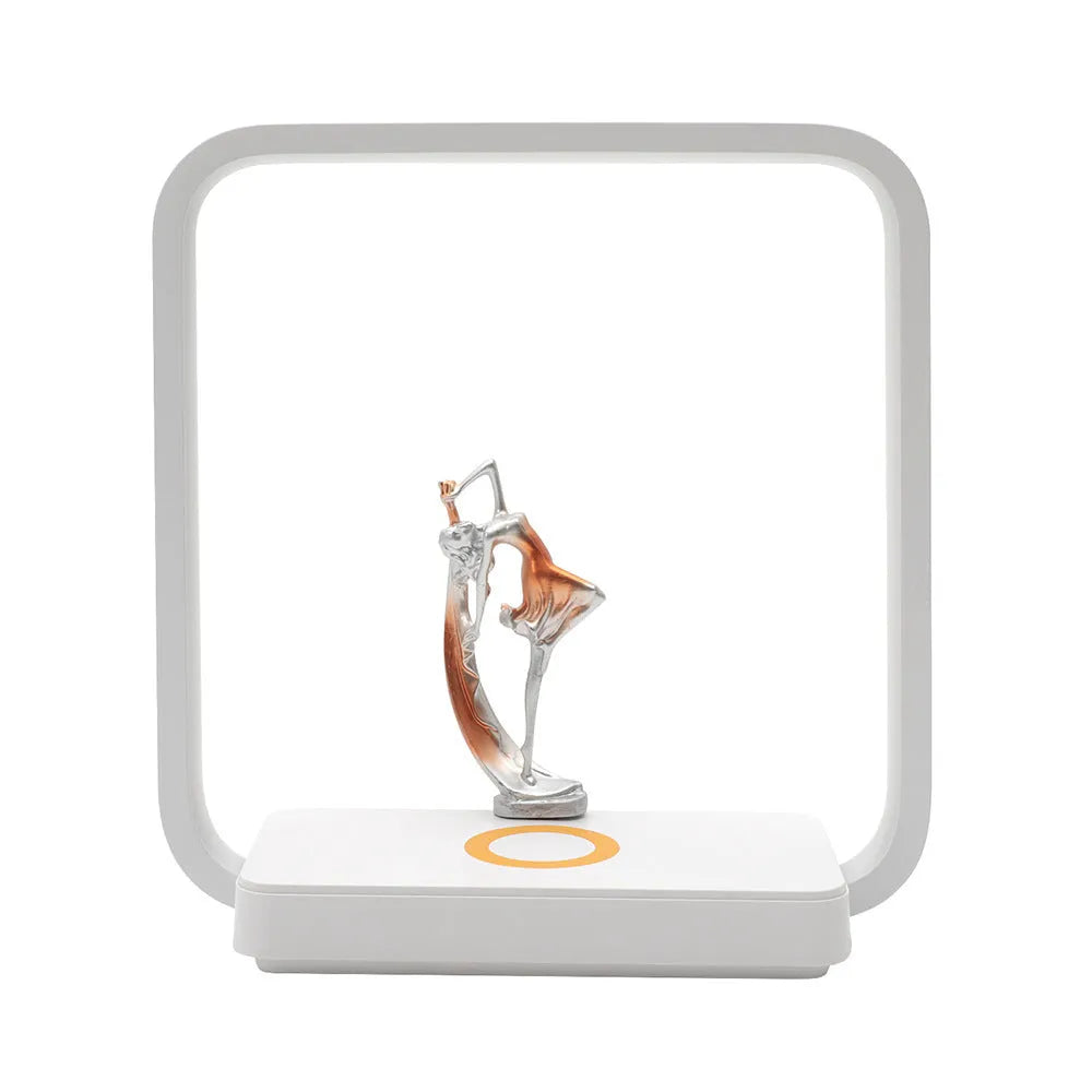 Blue atmosphere table lamp with integrated wireless phone charging pad showing smartphone placement
