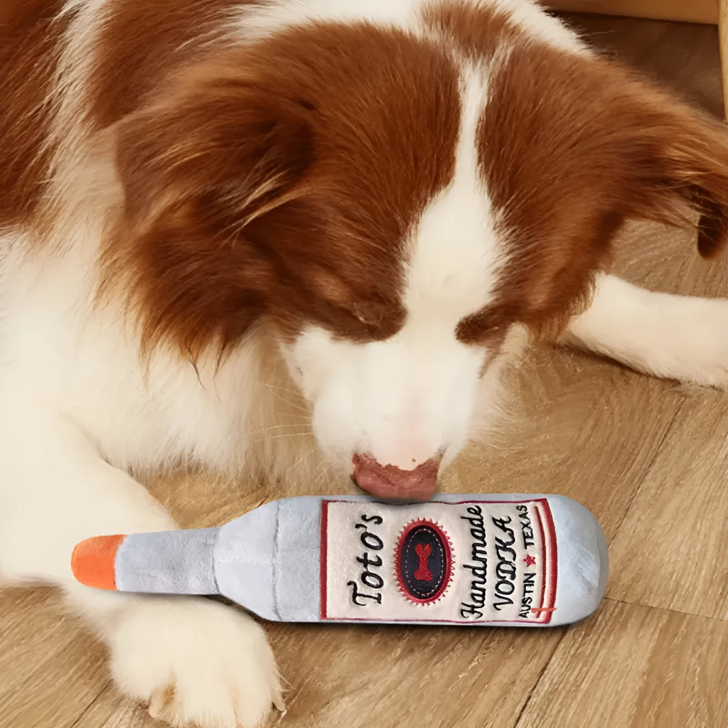 Brown plush wine bottle shaped dog toy with squeaker for chewing and play
