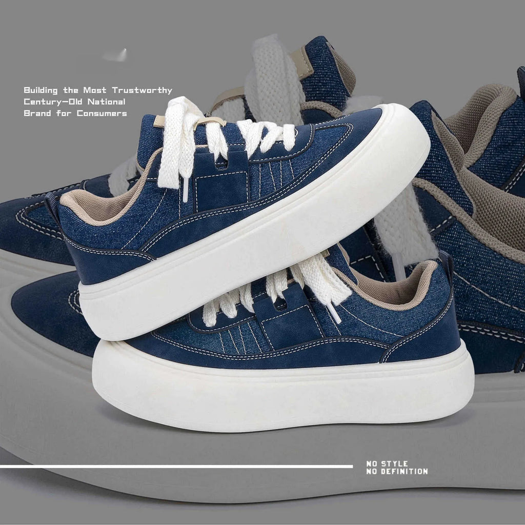 Men's black platform canvas trainers with lace-up front and raised sole on a white background