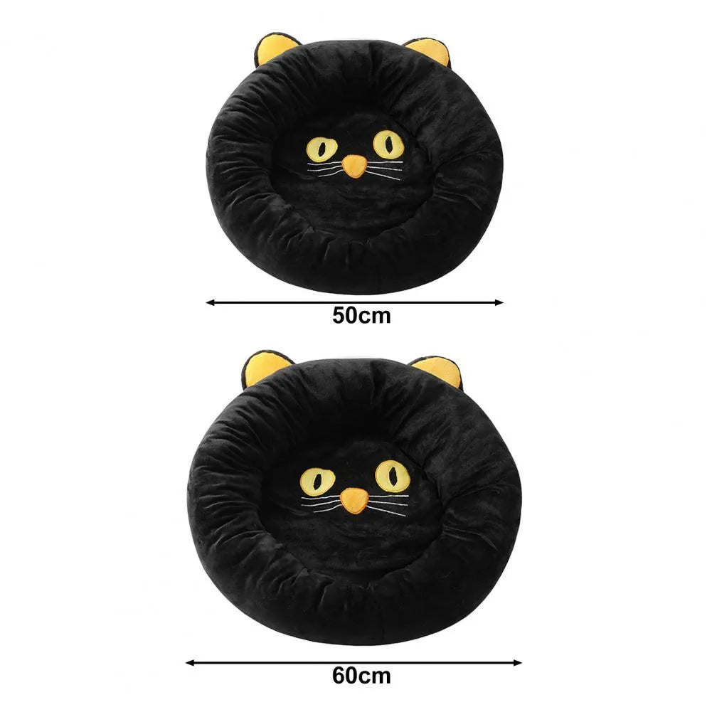 Black cat shaped velvet pet bed with raised edges for feline head and neck support