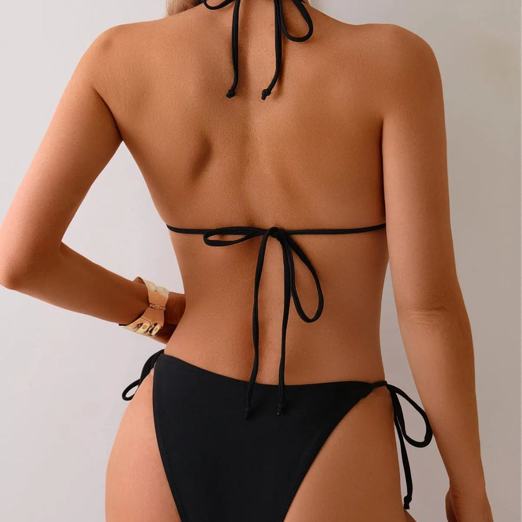 Black women's bikini swimsuit with metal bead detailing on polyester fabric
