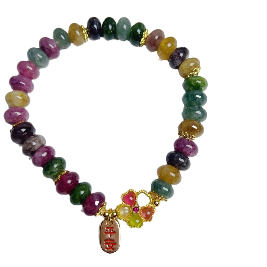 Colourful artificial crystal abacus bead bracelet with tourmaline-style stones on wrist