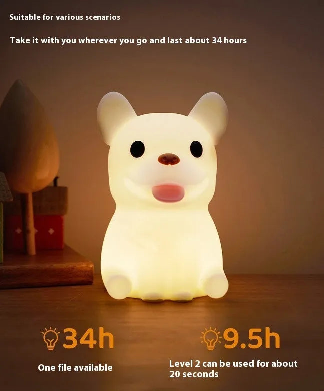 Cartoon animal silicone USB night light with dimmer switch on a bedside table.