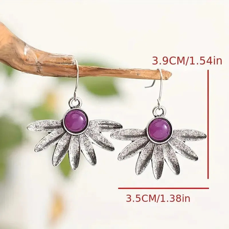 Purple Bohemian earrings with animal modelling and resin gemstone details on alloy framework