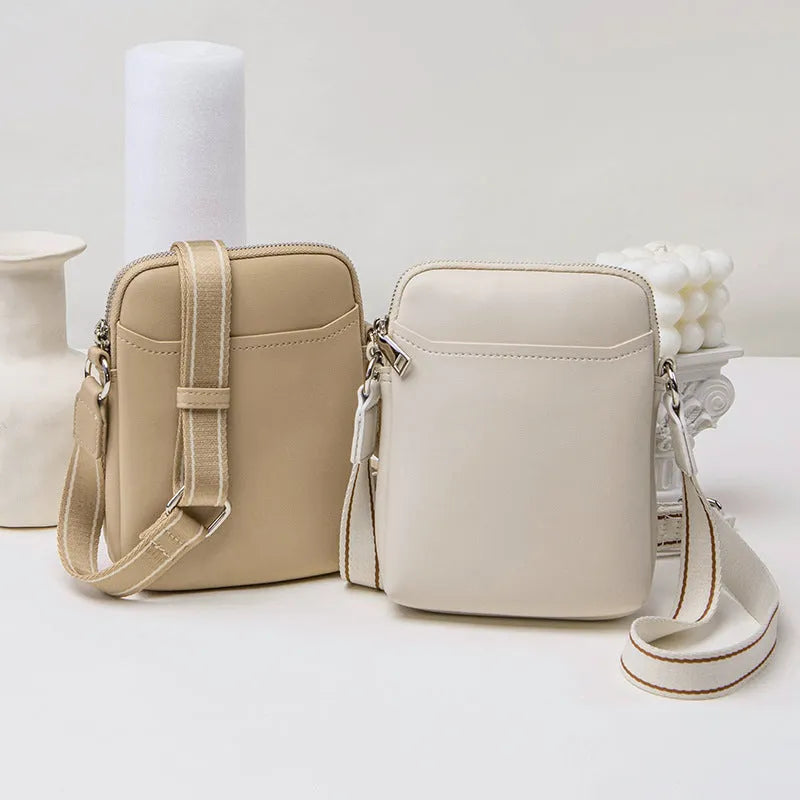 Solid colour PU leather mobile phone crossbody bag measuring 14.5x5.5x19cm