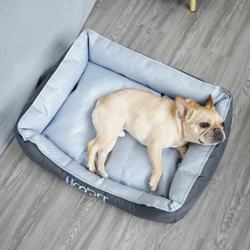 Soft grey dog bed with removable cover in small, medium, and large sizes.