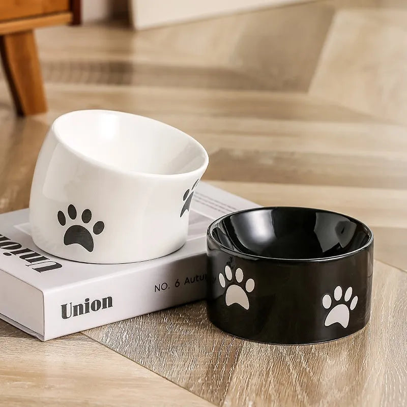 Ceramic high foot cat food bowl with cat paw print decoration in chosen colour