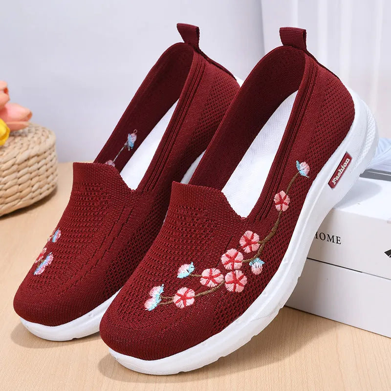 Women's embroidered woven sports pumps in wine red with a low flat heel and round toe.
