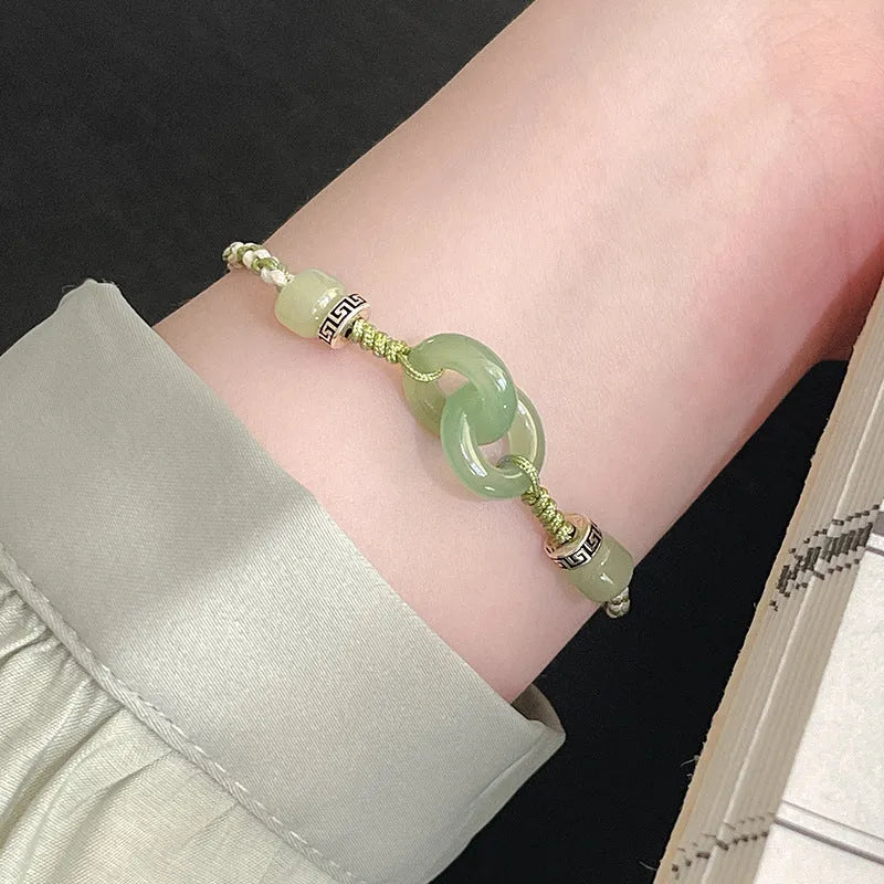 Women's ethnic style copper bracelet with peace buckle and double ring design in green.