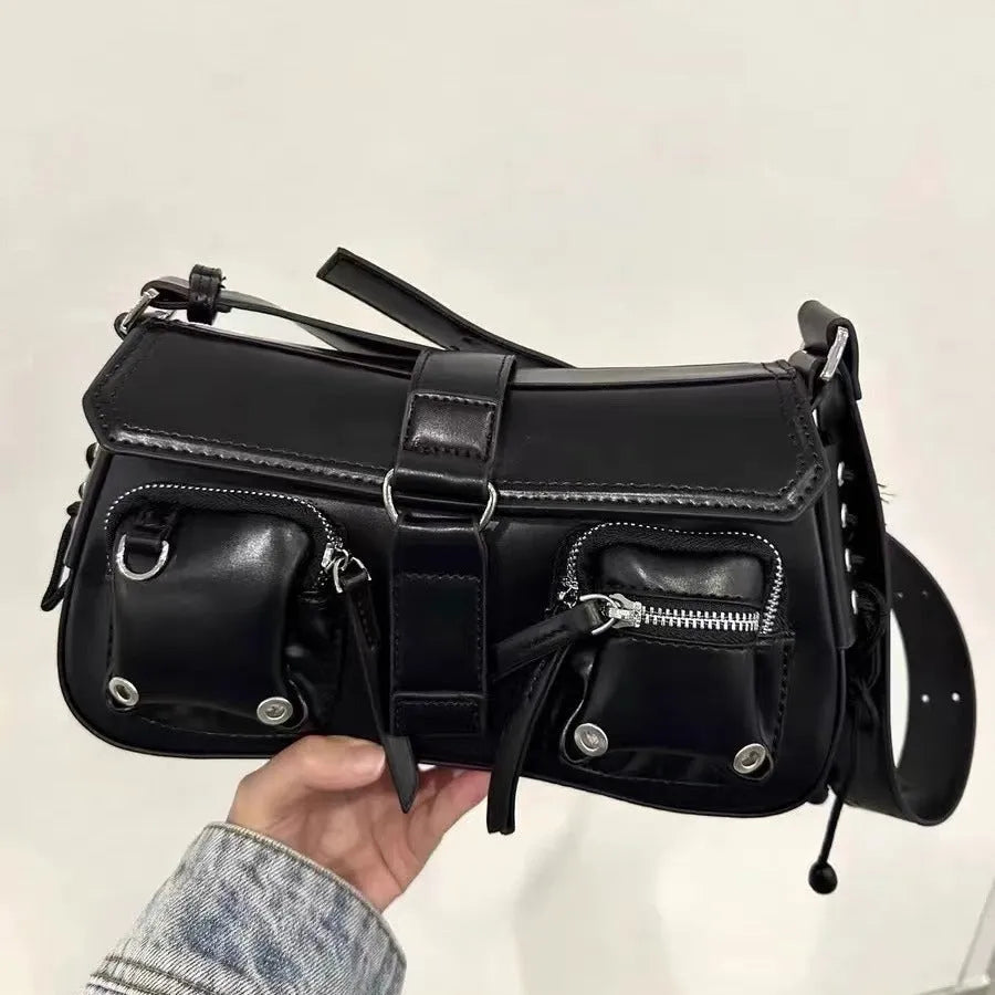 Black women's messenger bag with adjustable shoulder strap showing zipper pocket interior