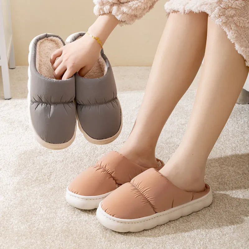 Blue down cotton slippers with artificial leather uppers, thick rubber soles, and plush lining for indoor winter wear.