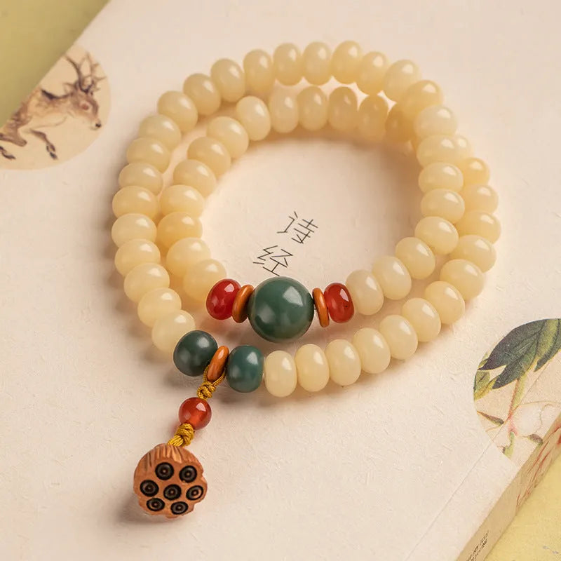 Wooden milk butter Bodhi root bracelet with 6x9mm flat round beads on wrist