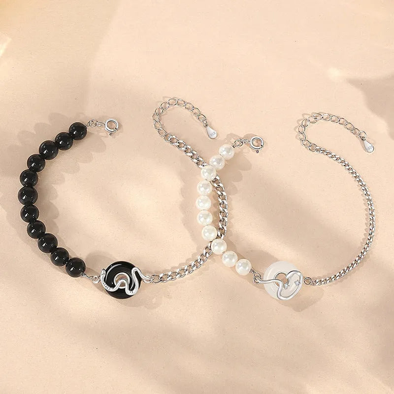 925 sterling silver couple bracelet with obsidian pearl, snake motif, and peace buckle clasp in New Chinese style.