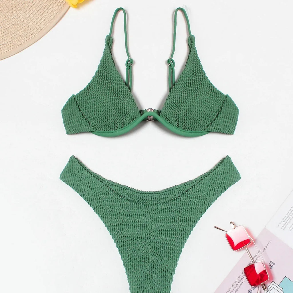 Green women's bikini with ruffle detail on quick-dry polyester fabric.