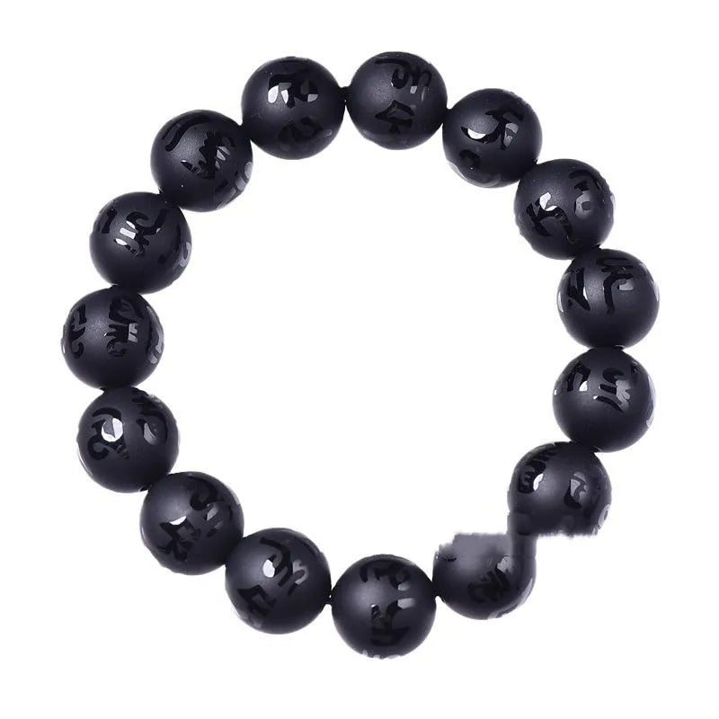 Natural frosted black agate bracelet engraved with a Sanskrit mantra, showing stone-coloured glaze.