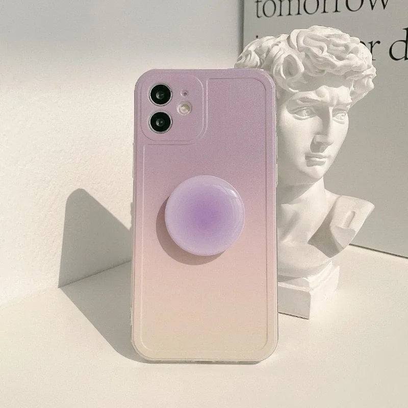 Yellow and purple gradient silicone iPhone case with a retractable viewing stand extended.