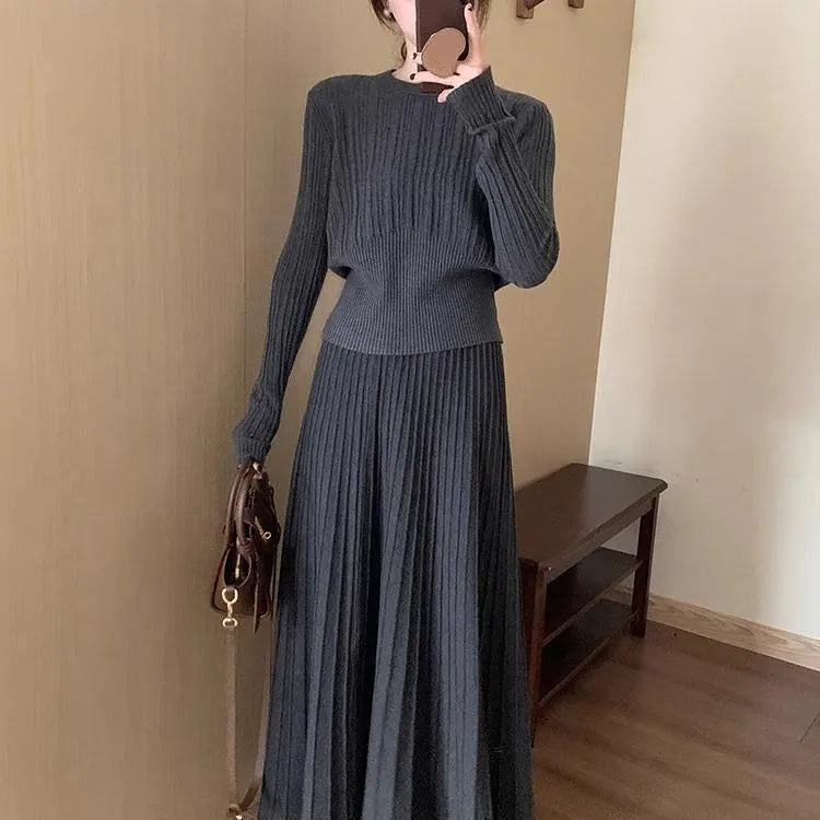 Dark grey knitted ethnic style dress suit with black collage stitching and matching skirt.