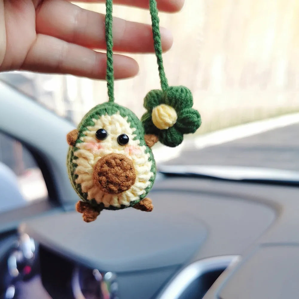 Handmade crocheted avocado rainbow flower car pendant made from wool yarn.
