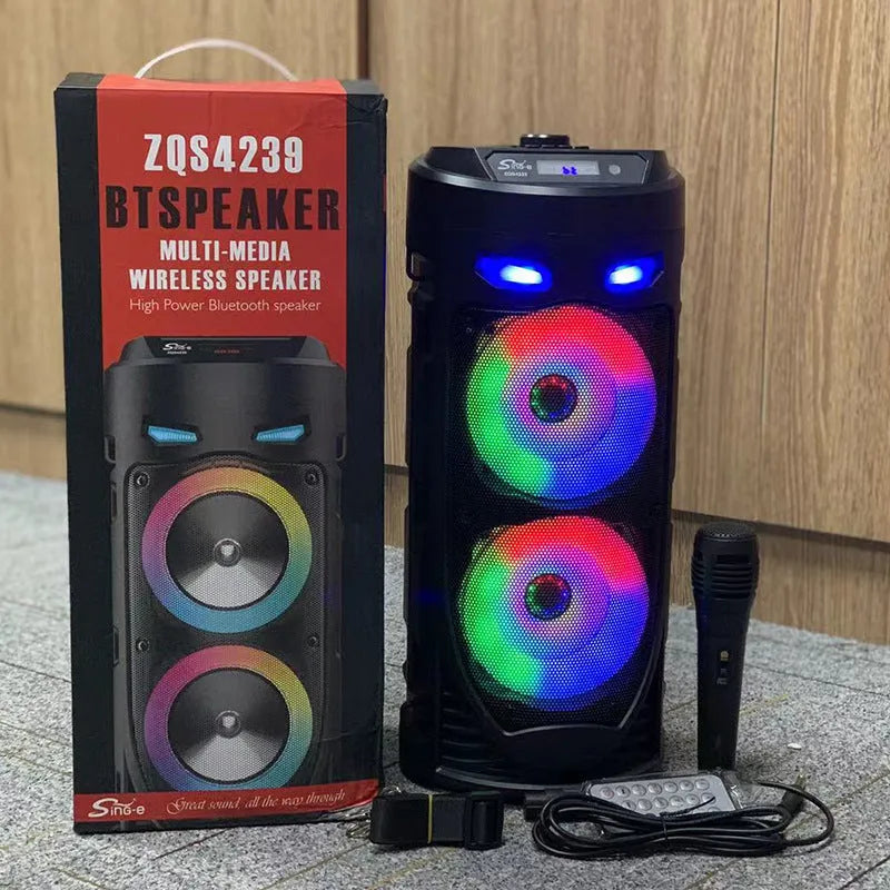 Black portable Bluetooth speaker with colourful dual horns, showing front panel with controls.