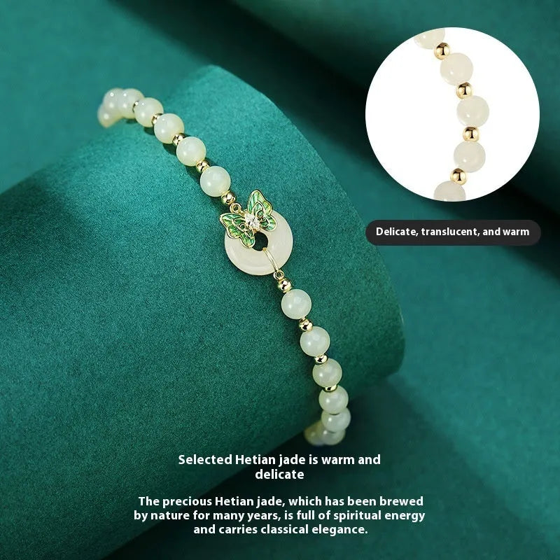 Cyan Hetian Jade bracelet with sterling silver butterfly design, 6mm beads.