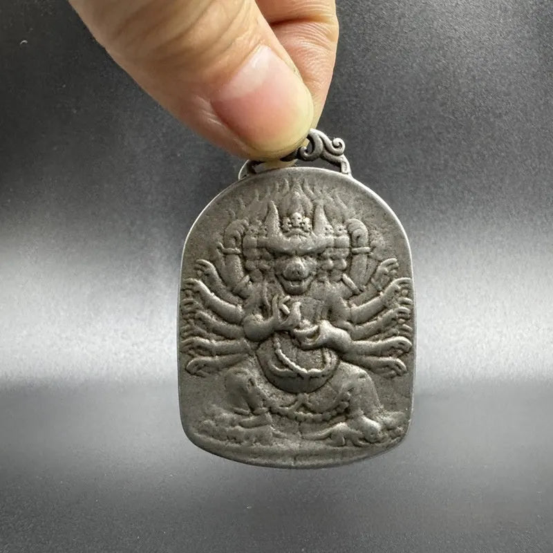 Chinese style antique iron geometrical hanging ornament pendant on a wall.
