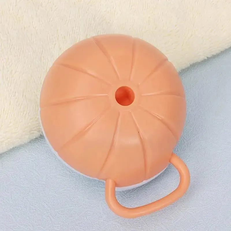 Orange silicone dog bath brush with shampoo dispenser and massage bristles for pet grooming