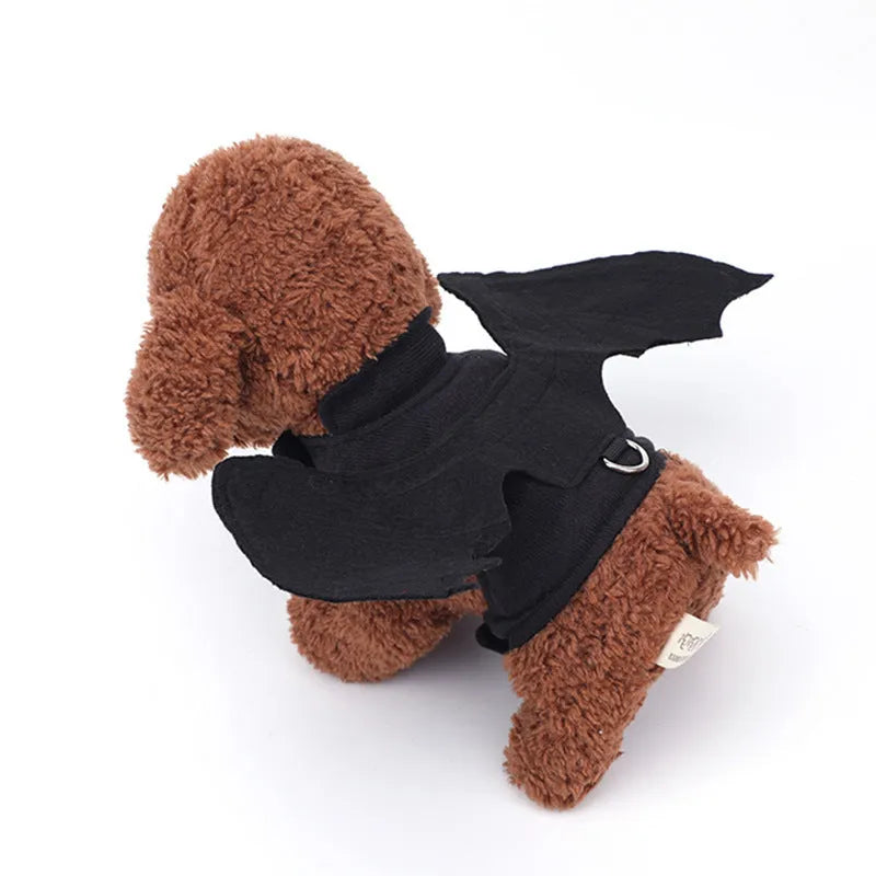 Black bat wing costume accessory for dogs showing chest and back attachment with optional traction rope
